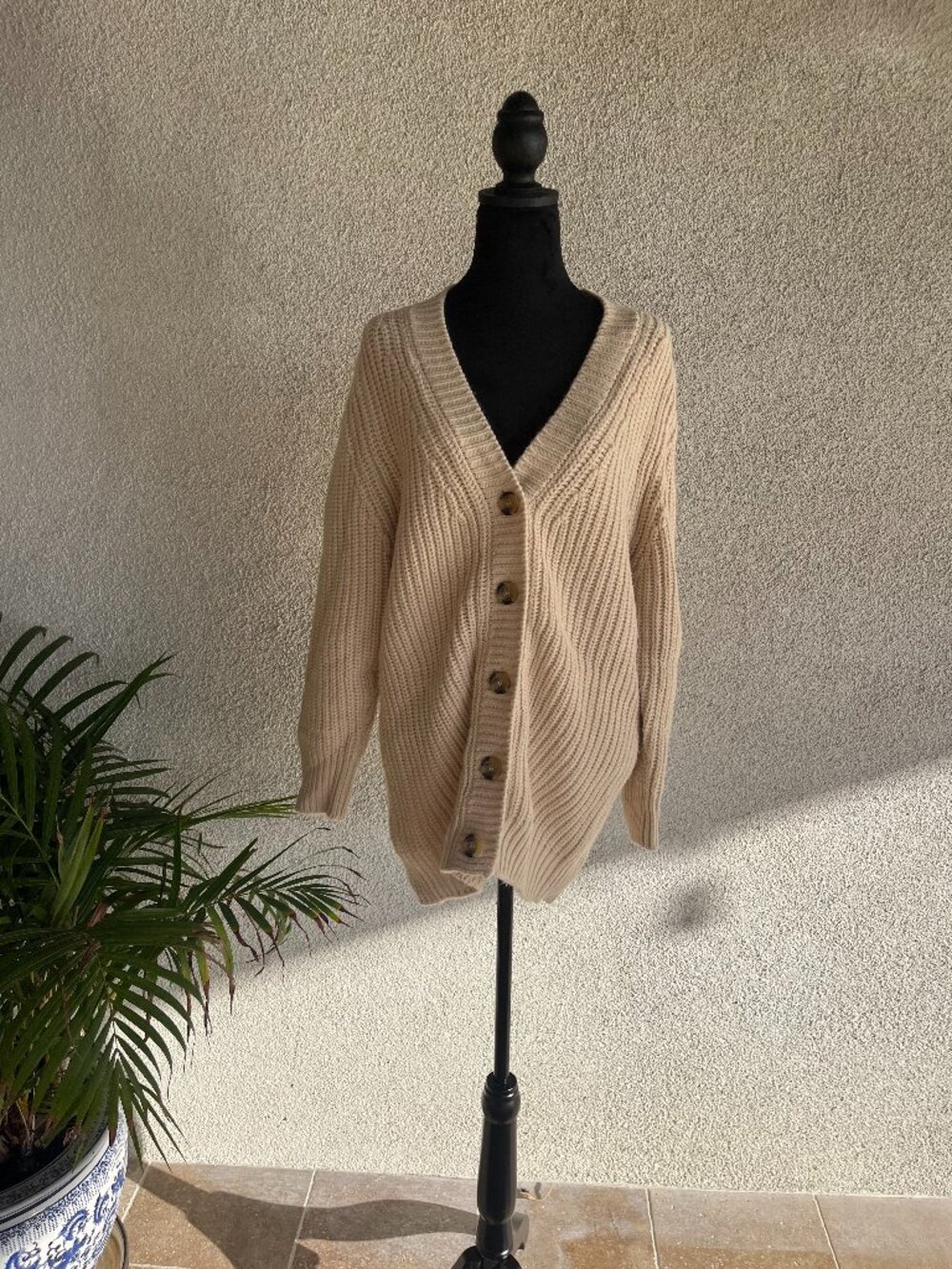 Cream colored long Cardigan.